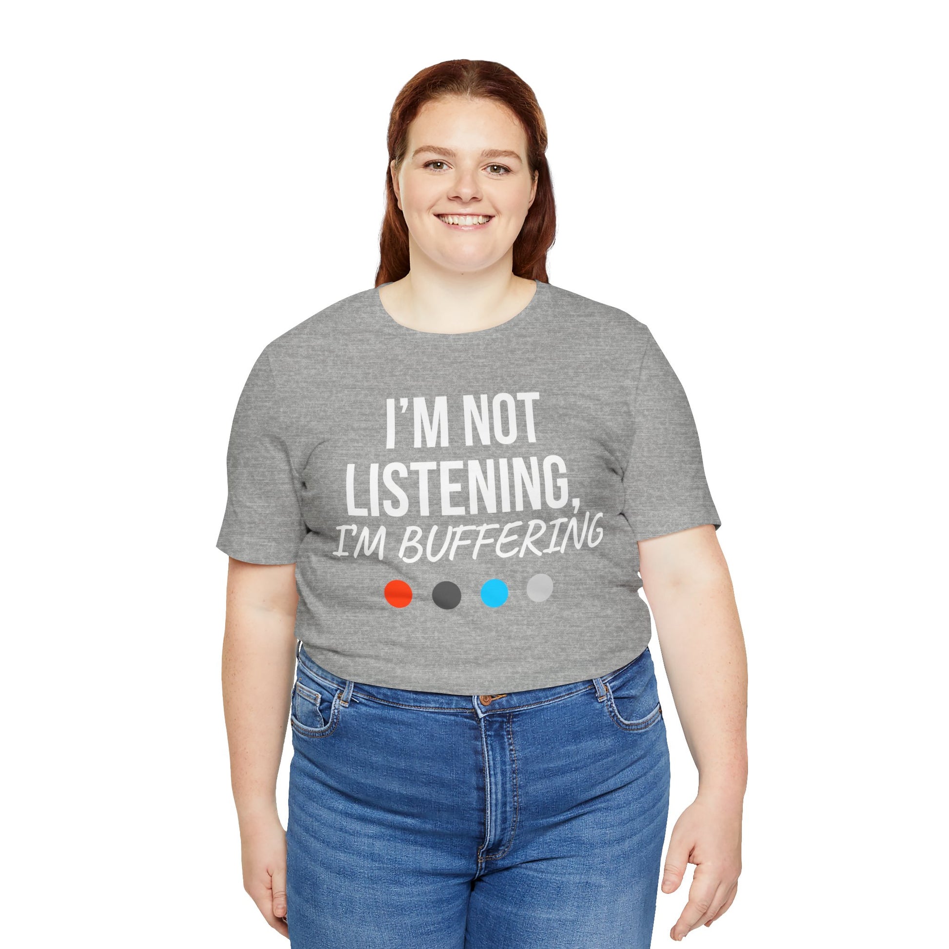 Person wearing a gray t-shirt with 'I'm Not Listening, I'm Buffering' text on a white background