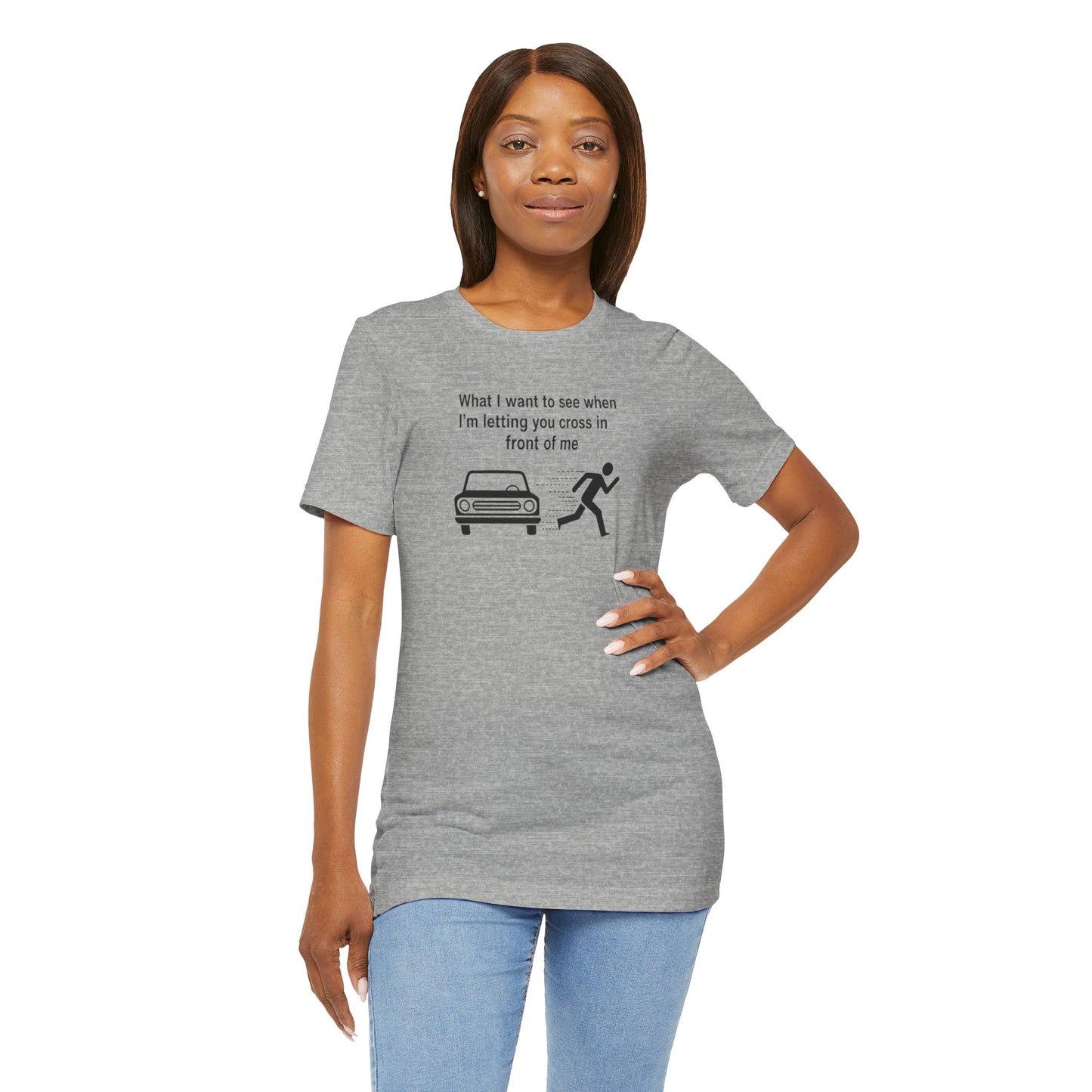 Woman wearing a gray t-shirt with a graphic and text 'What I want to see when I'm letting you cross in front of me' on a white background