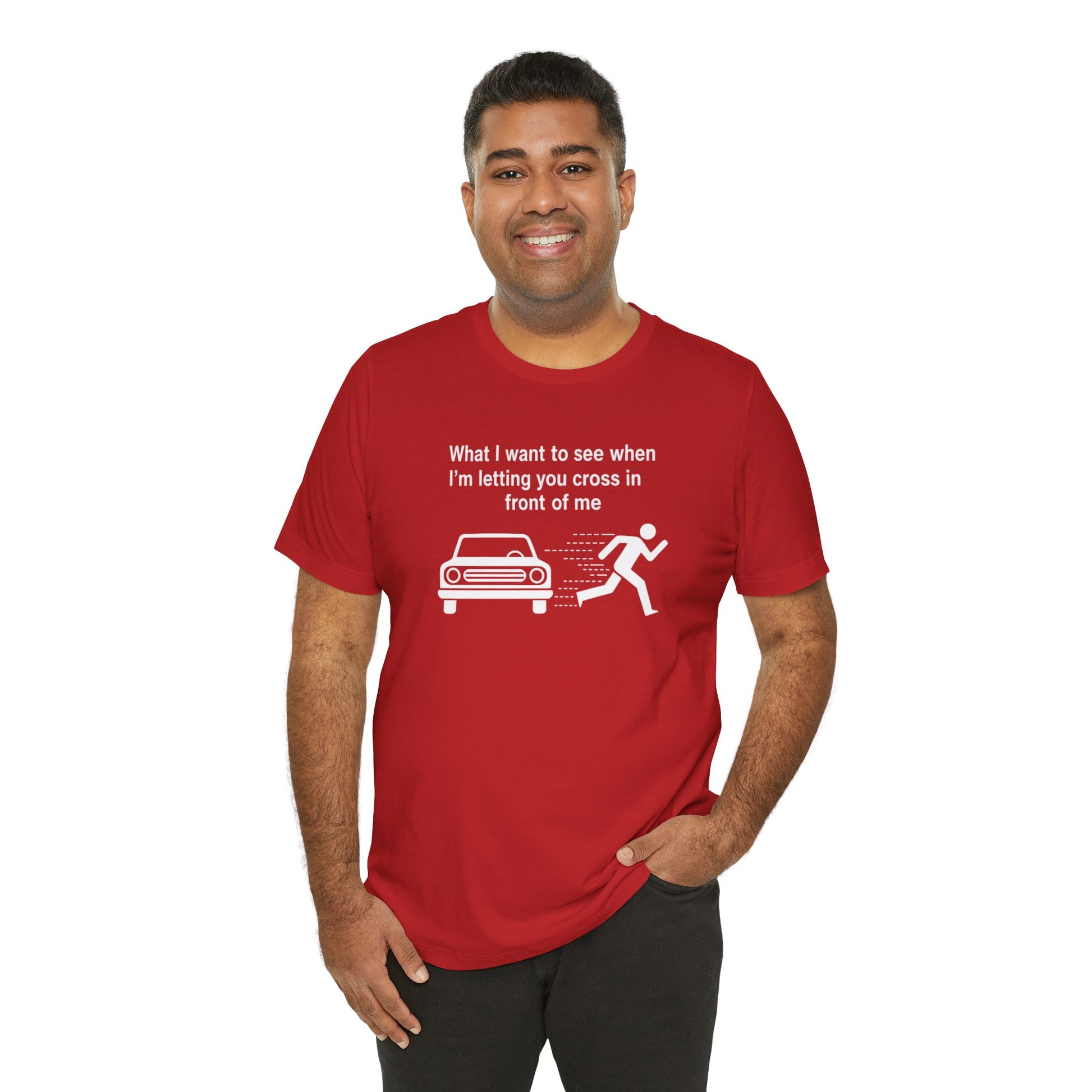 Man wearing a red t-shirt with a graphic and text 'What I want to see when I'm letting you cross in front of me' on a white background