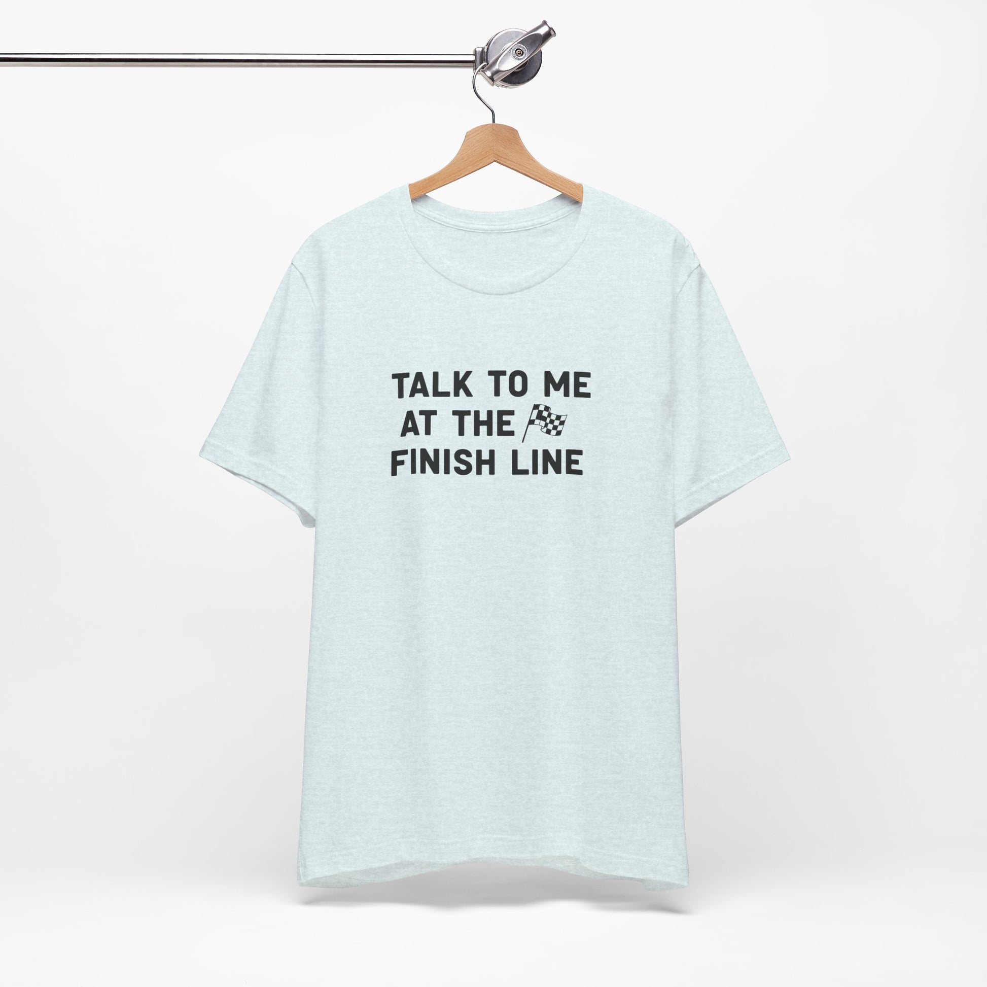 Light blue t-shirt with 'Talk to me at the finish line' text on a white background