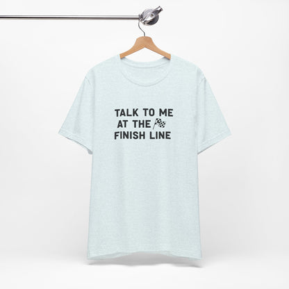 Light blue t-shirt with 'Talk to me at the finish line' text on a white background