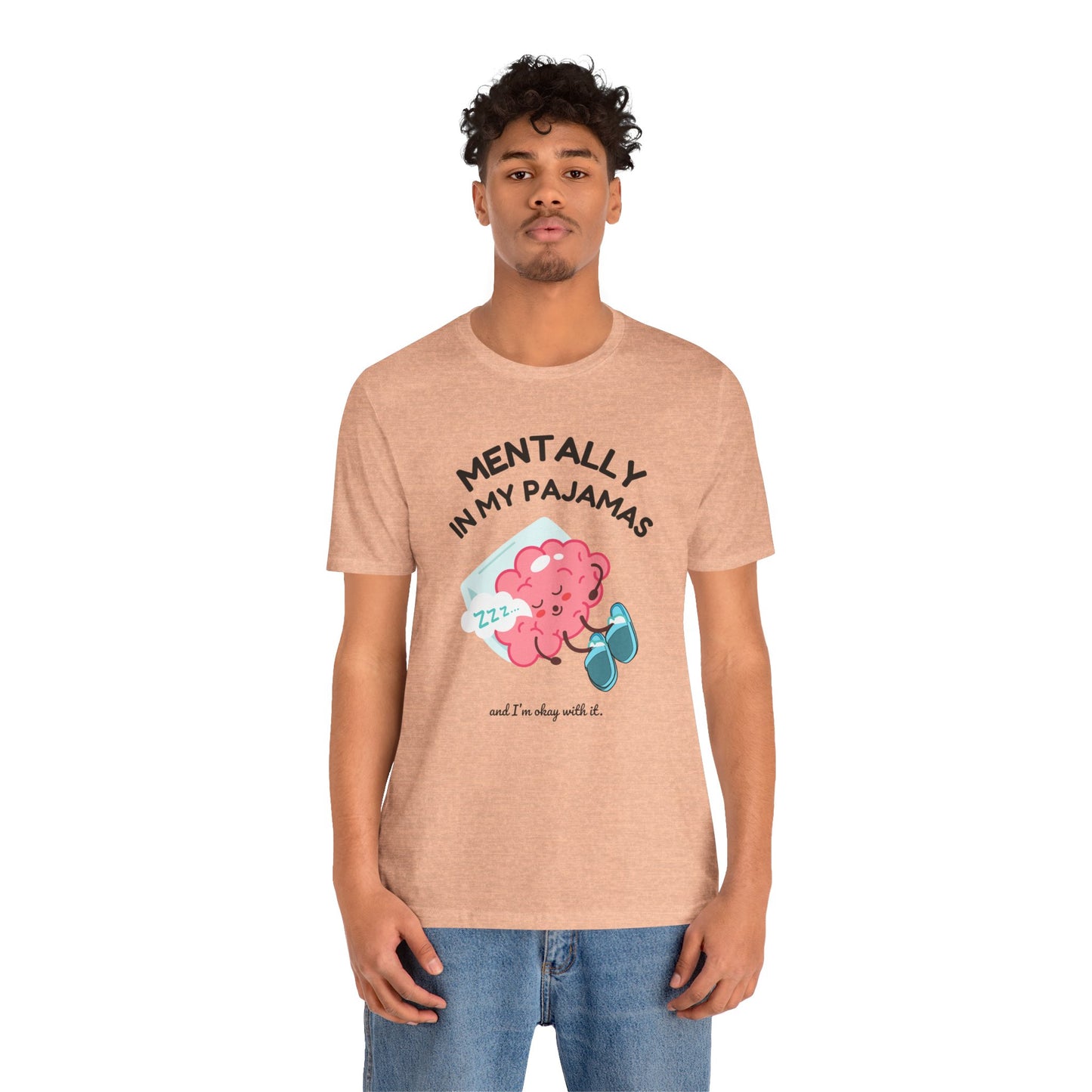 Person wearing a tan t-shirt with a graphic and text 'Mentally in my pajamas and I'm ok with it' on a white background