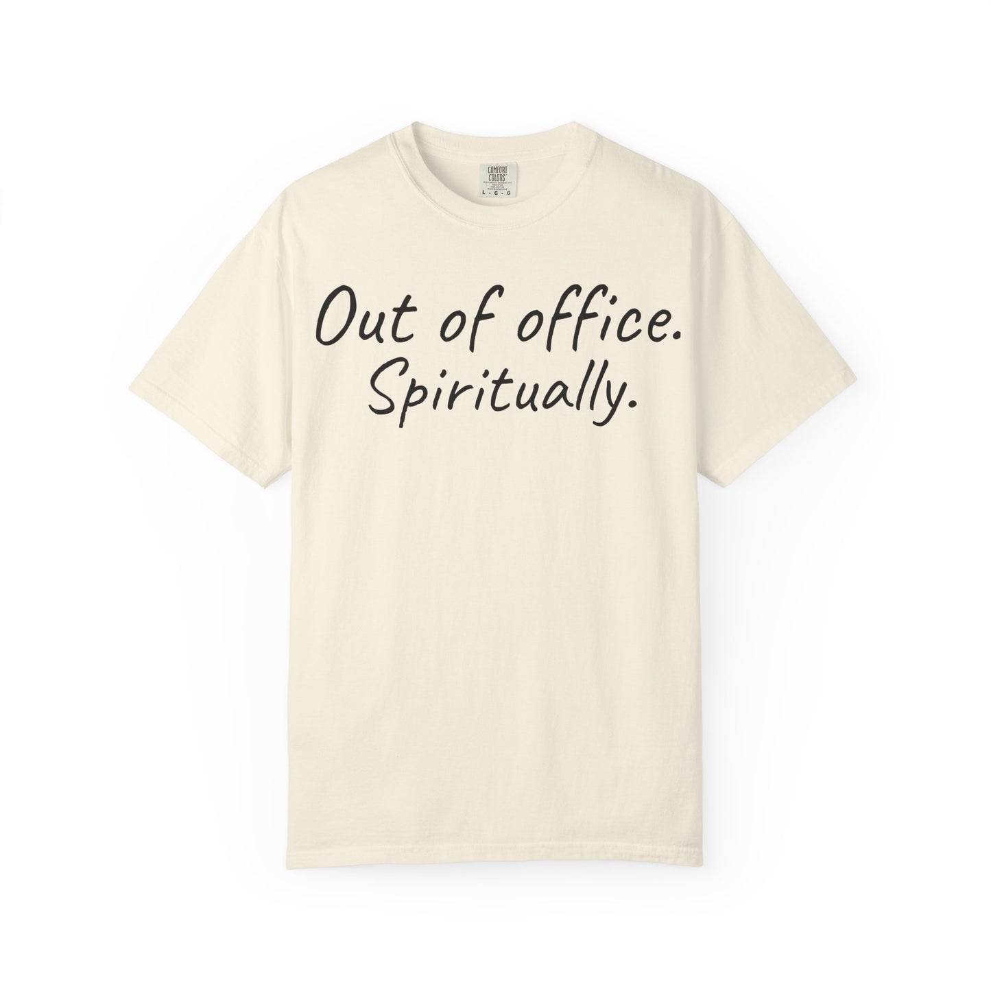 Beige t-shirt with text 'Out of office. Spiritually.' on a white background