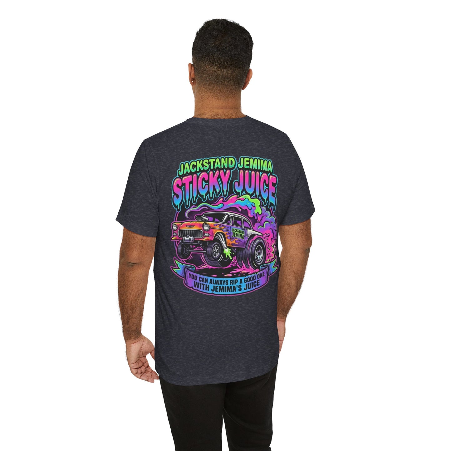 Person wearing a dark gray t-shirt with colorful graphic design on the back, featuring text 'Jackedstand Jemima Sticky Juice You Can Always Rip A Good One With Jemima's Juice' and a car illustration.