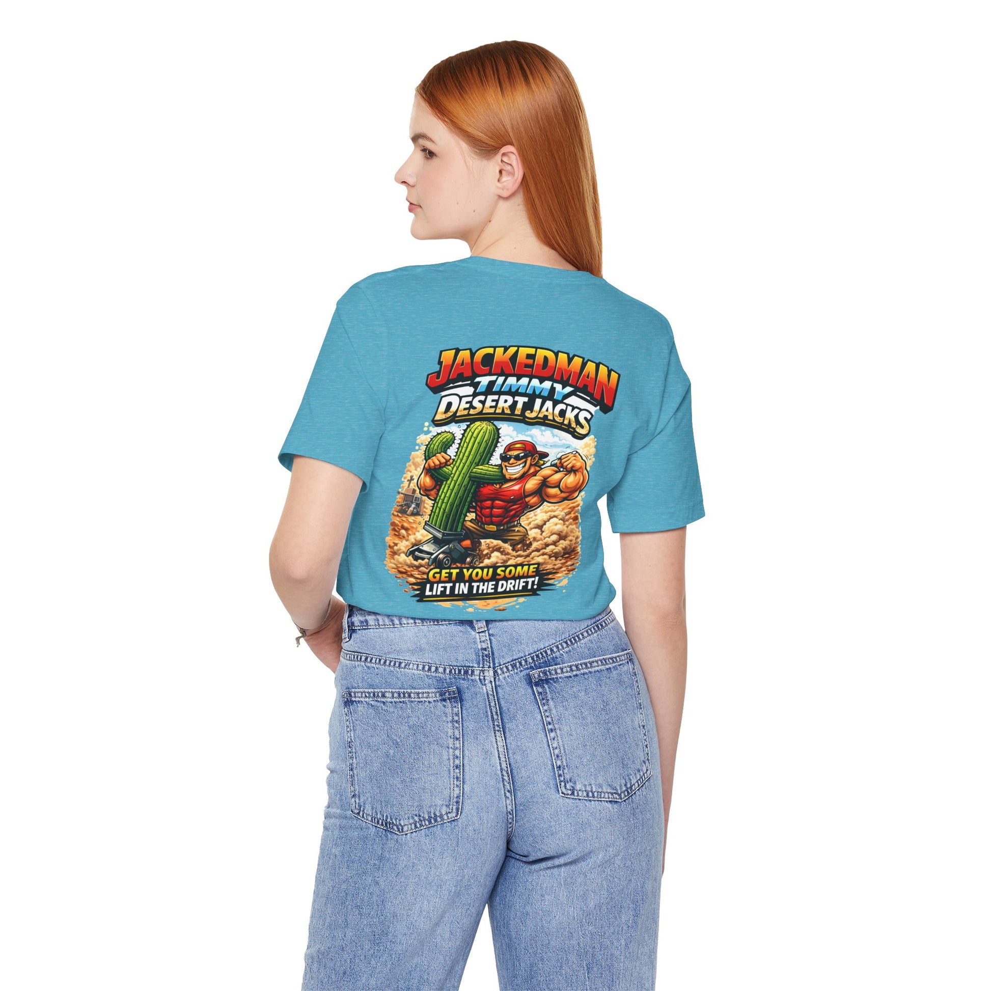 Person wearing a blue t-shirt with a graphic design and 'Jackedman Timmy Desert Jacks Get You Some Lift In The Drift' text on the back, standing against a white background