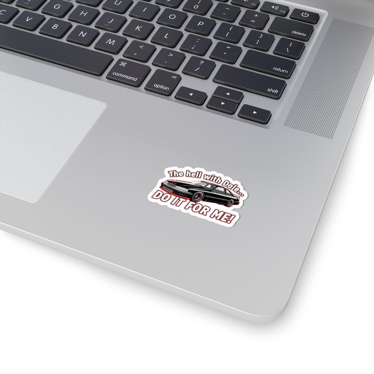 Laptop with a sticker featuring a car and text 'The hell with Dale Do it for me' on the palm rest area.