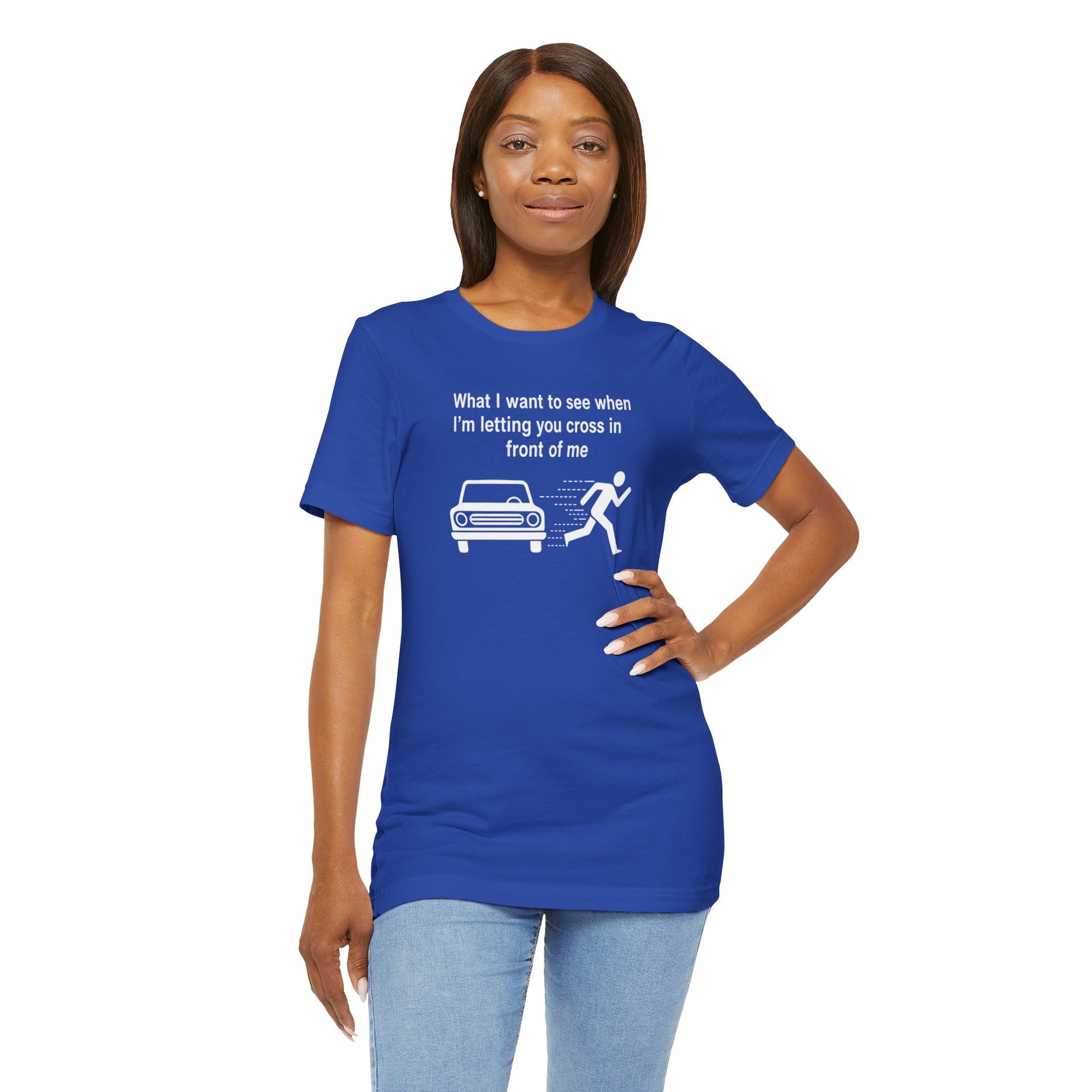 Woman wearing a blue t-shirt with a graphic and text 'What I want to see when I'm letting you cross in front of me' on a white background