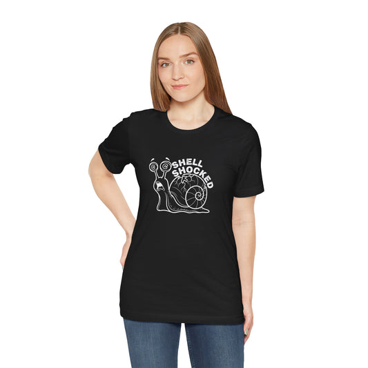 Person wearing a black t-shirt with a snail graphic and 'Shell Shocked' text on a white background