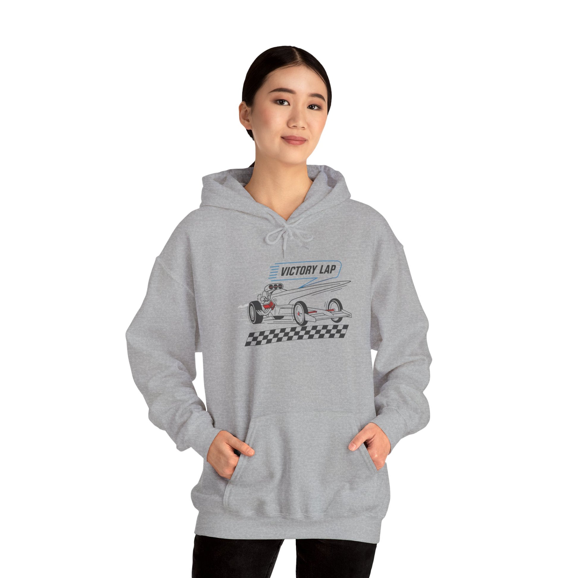 Person wearing a gray hoodie with a race car graphic 'VICTORY LAP' on a white background