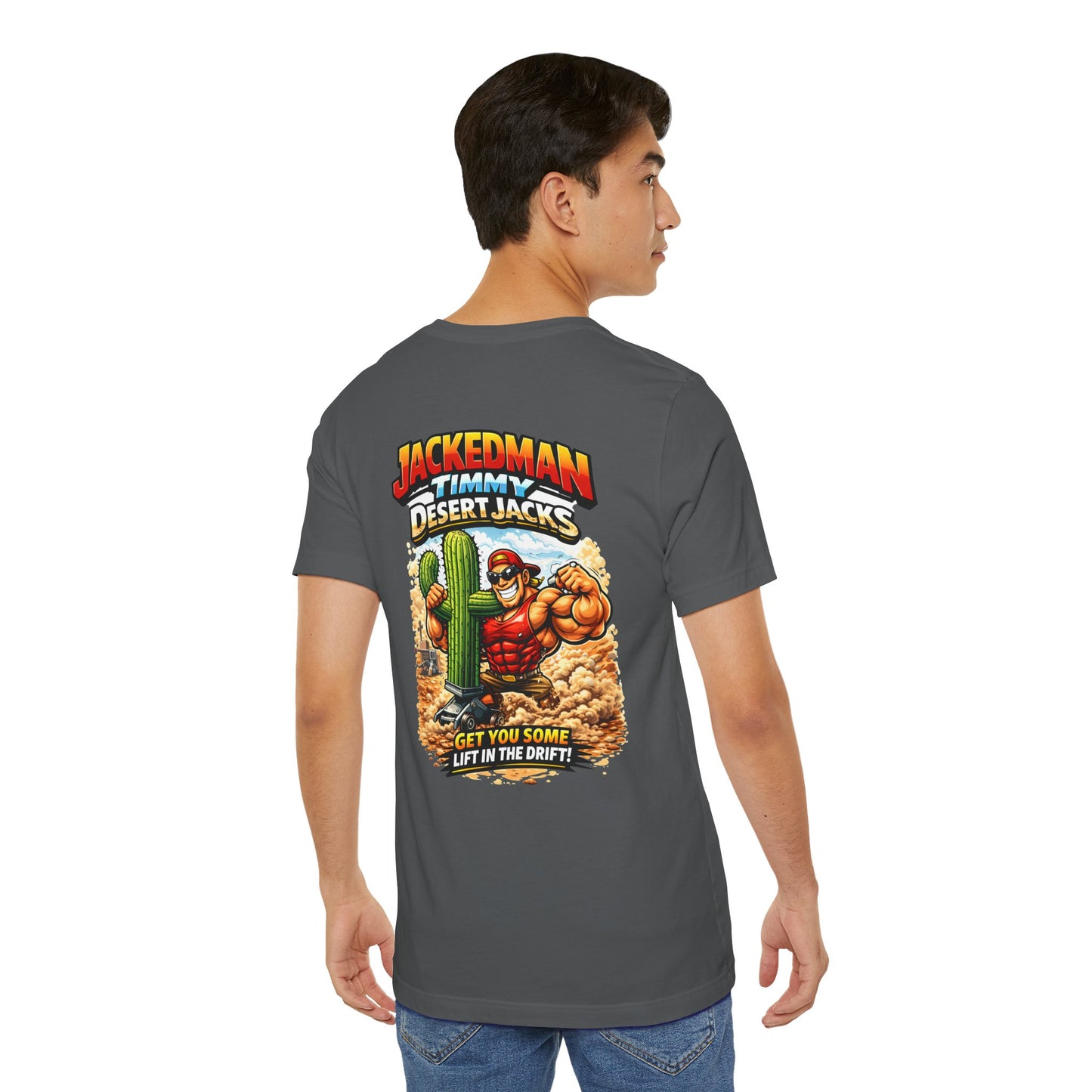 Person wearing a gray t-shirt with a colorful graphic on the back, featuring a character and 'Jackedman Timmy Desert Jacks Get You Some Lift In The Drift' text.