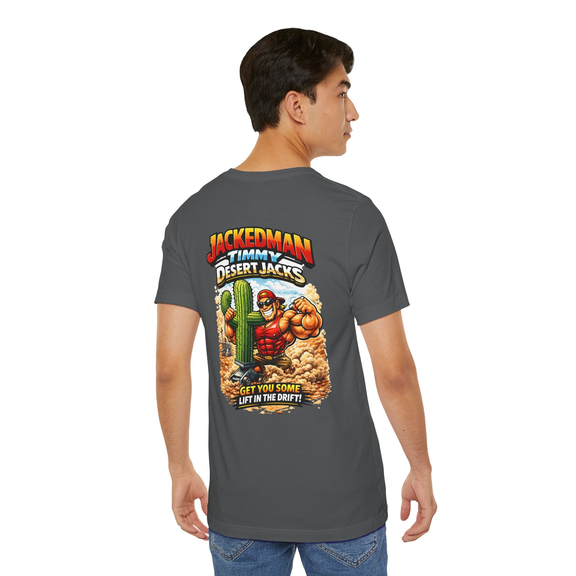 Person wearing a gray t-shirt with a colorful graphic on the back, featuring a character and 'Jackedman Timmy Desert Jacks Get You Some Lift In The Drift' text.