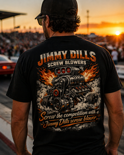 Man wearing a black t-shirt with 'Jimmy Dills Screw Blowers' graphic design at sunset.