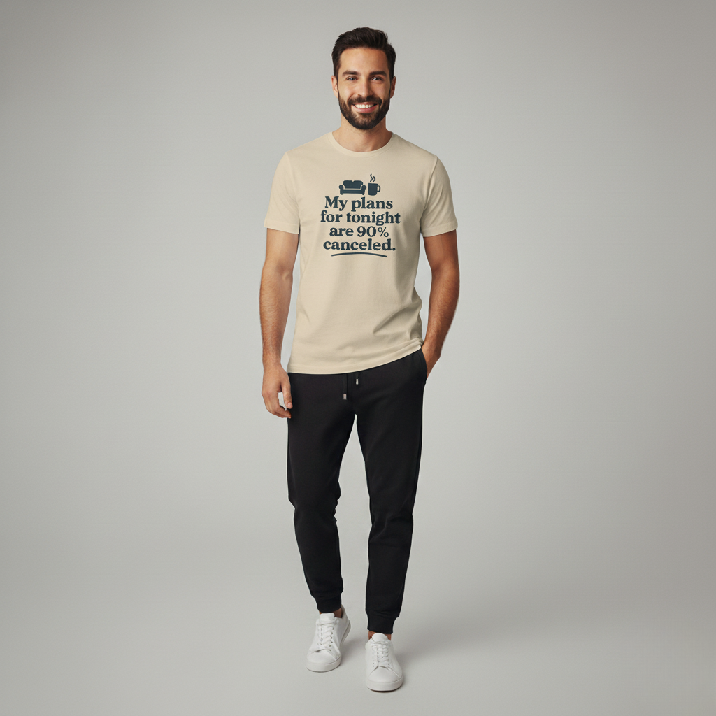 Man wearing a beige t-shirt with text 'My plans for tonight are 90% canceled', standing against a plain background