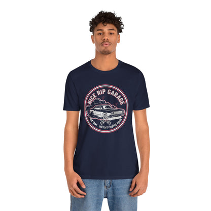 Person wearing a navy blue t-shirt with a graphic design and text 'Nice Rip Garage Get that old fart ripping again' on a white background