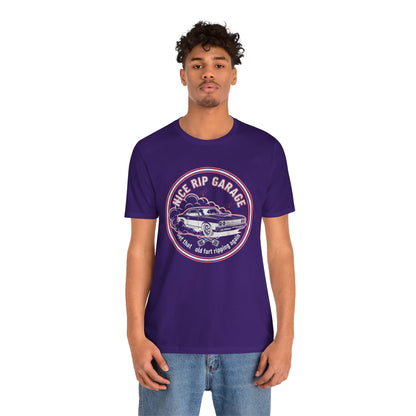 Person wearing a purple t-shirt with a graphic design and text 'Nice Rip Garage Get that old fart ripping again' on a white background