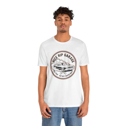 Person wearing a white t-shirt with a graphic design and text 'Nice Rip Garage Get that old fart ripping again' on a white background