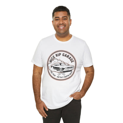 Man wearing a white t-shirt with a graphic design and text 'Nice Rip Garage Get that old fart ripping again' on a white background