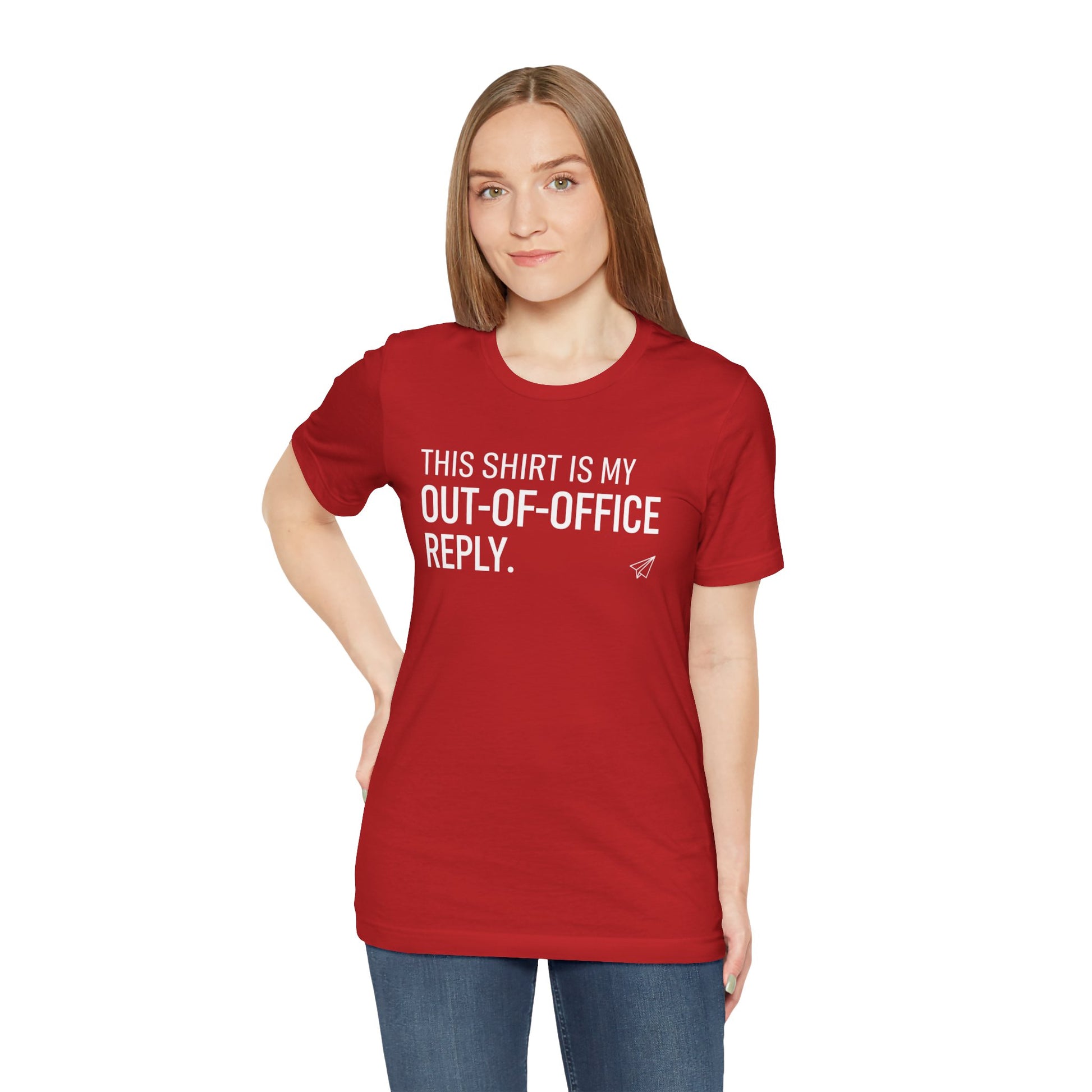 Person wearing a red t-shirt with text 'This shirt is my out-of-office reply' on a white background
