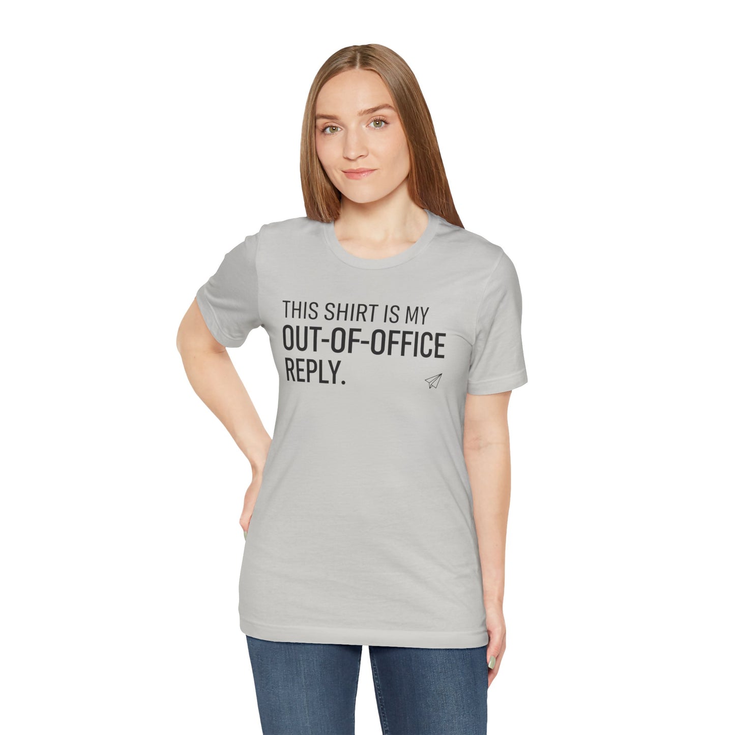 Woman wearing a gray t-shirt with text 'This shirt is my out-of-office reply' on a white background