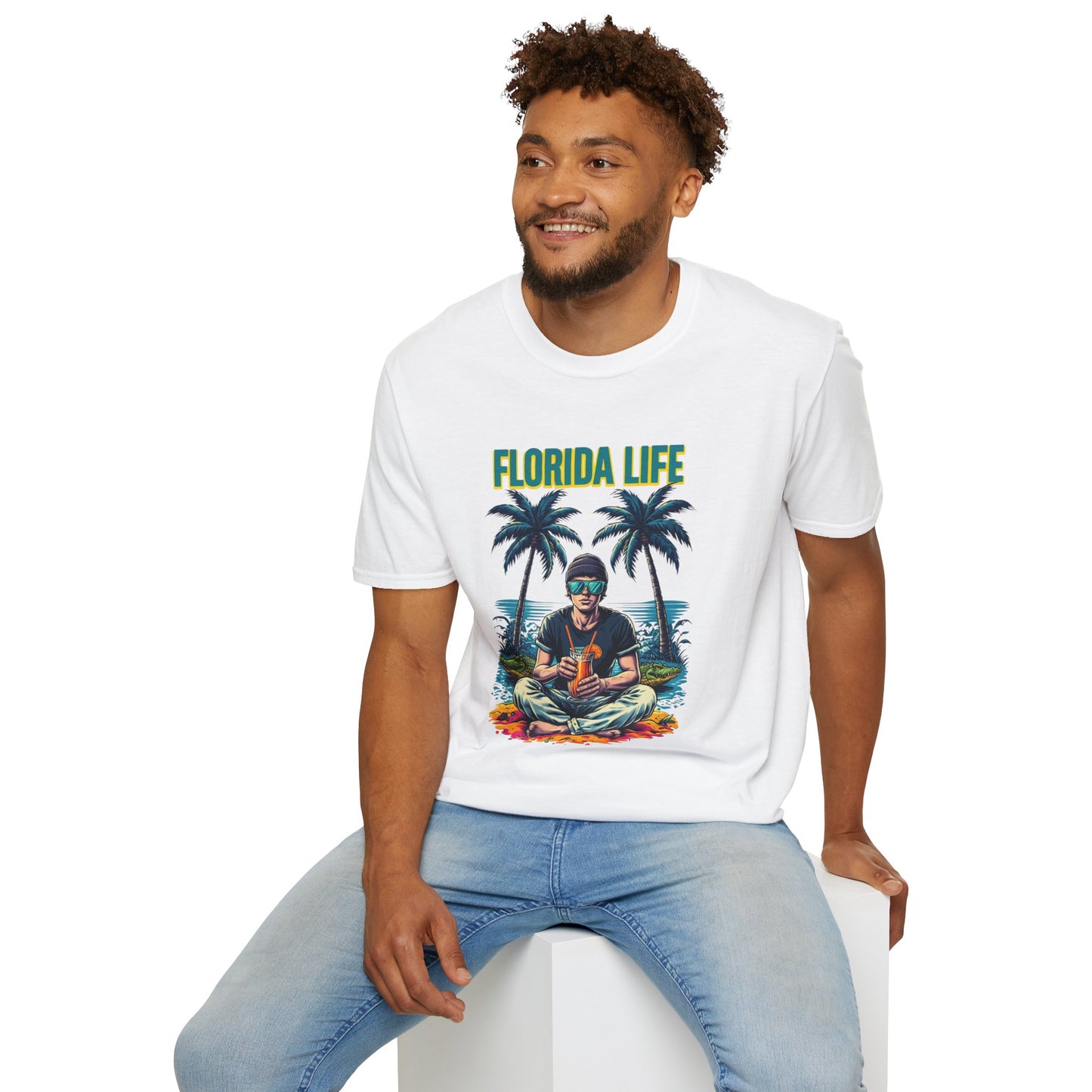 Man wearing a white t-shirt with 'Florida Life' design sitting on a white stool.