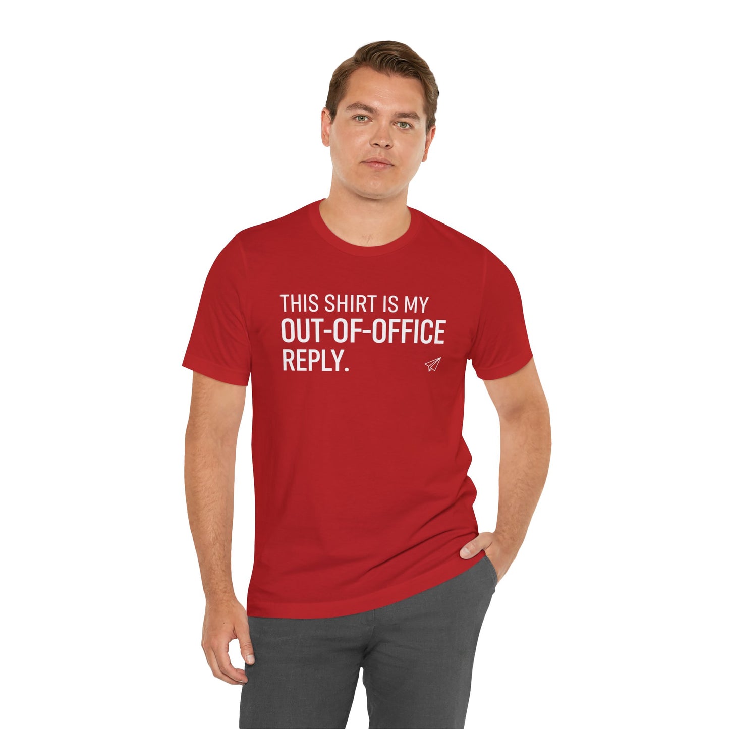 Man wearing a red t-shirt with text 'This shirt is my out-of-office reply' on a white background