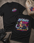 Two black graphic T-shirts laid flat on a textured gray surface, with a vintage gas can, black gloves, and a black funnel as styled props. The front shirt shows a small multicolor 'Big Booty Judy' chest graphic, and the back shirt shows a large colorful graphic of a woman standing on a pink car with the text 'Big Booty Judy' and 'Always Rides For Free'.