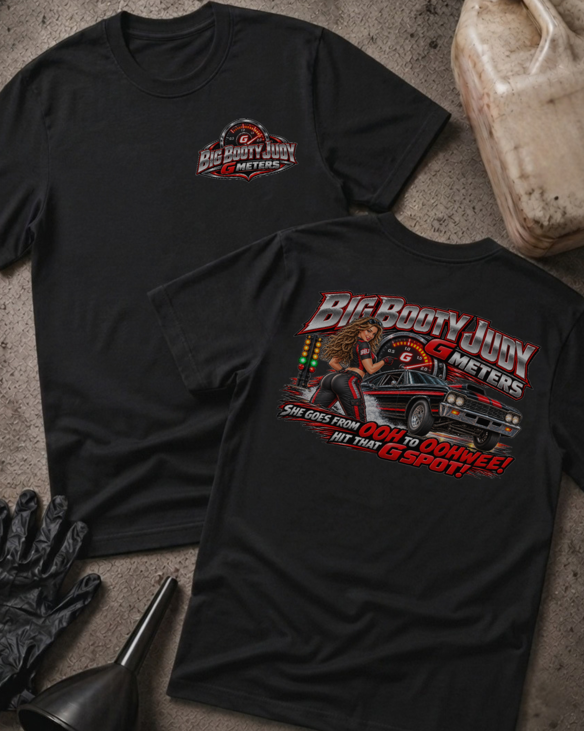  Black Big Booty Judy G Meter T-shirt with a small front chest logo and a large back print featuring a drag racing car, G-meter graphic, and racing humor.
