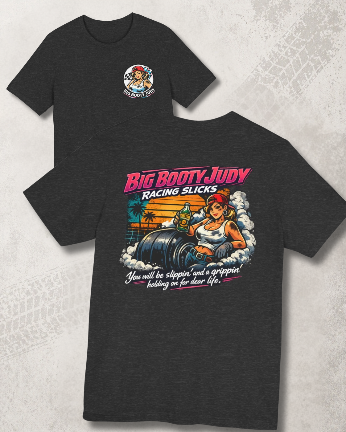 Black t-shirt with 'Big Booty Judy Racing Slicks' graphic design on a textured white background