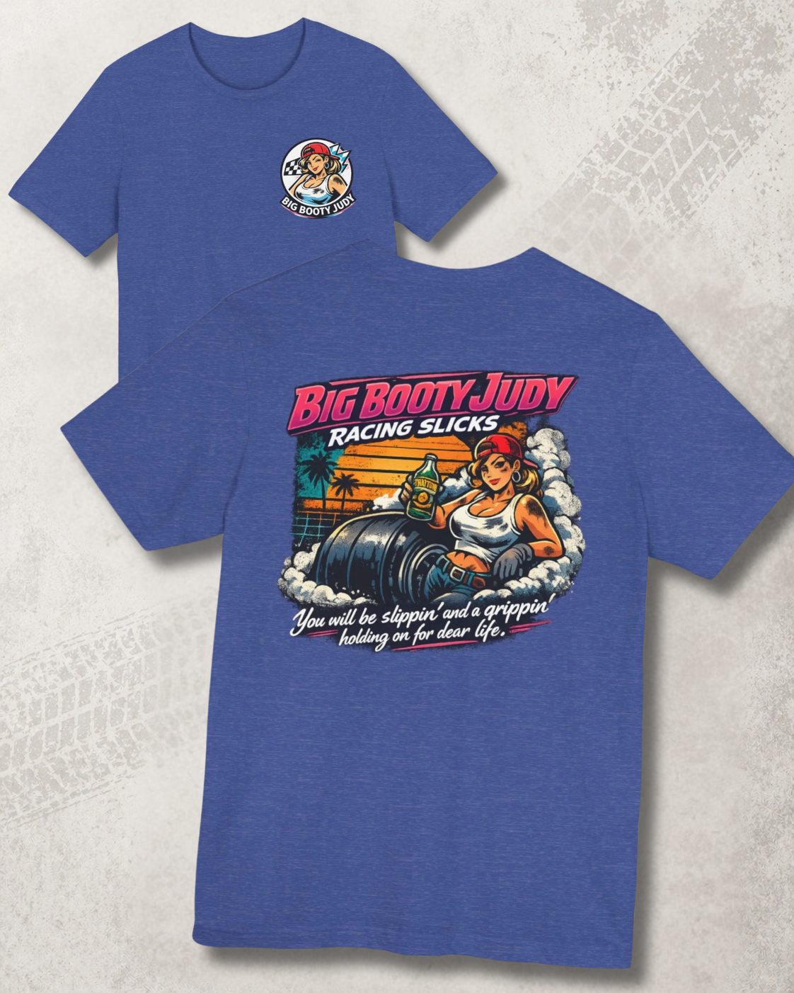 Blue t-shirt with 'Big Booty Judy Racing Slicks' graphic on a textured surface