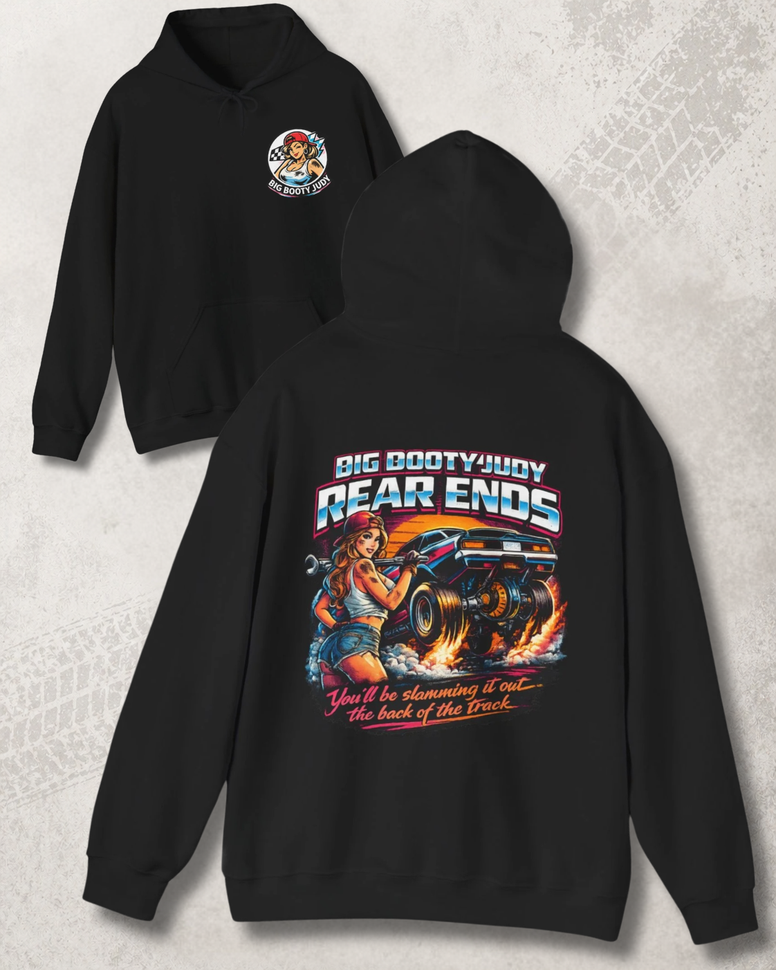 Black hoodie with Big Booty Judy Rear Ends graphic design on front and back on a textured gray background