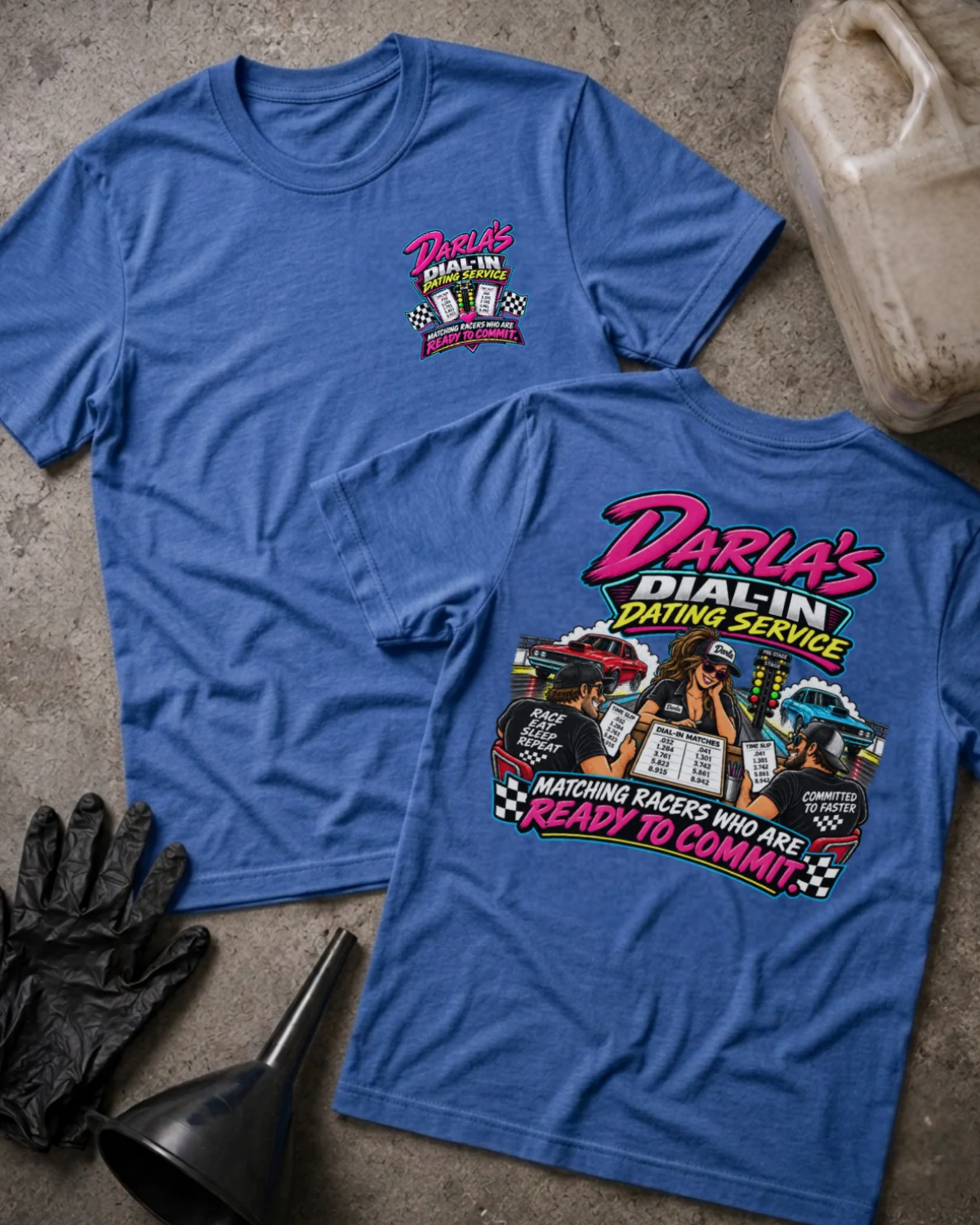 Front and back of Darla’s Dial-In Dating Service heather true royal T-shirt with chest logo, woman matching two racers, drag cars, and “Matching racers who are ready to commit” slogan.