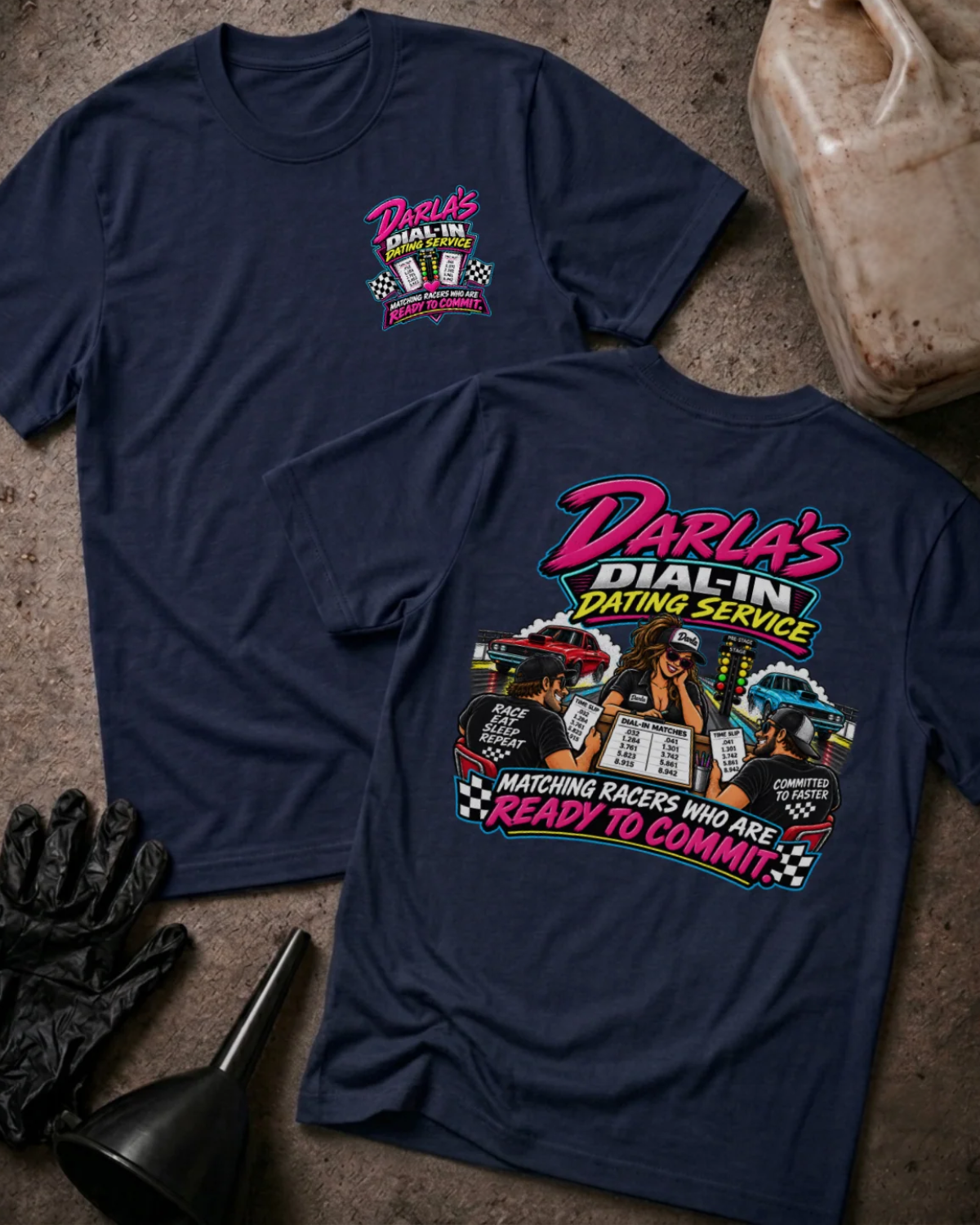 Front and back of Darla’s Dial-In Dating Service navy T-shirt with chest logo, woman matching two racers, drag cars, and “Matching racers who are ready to commit” slogan.
