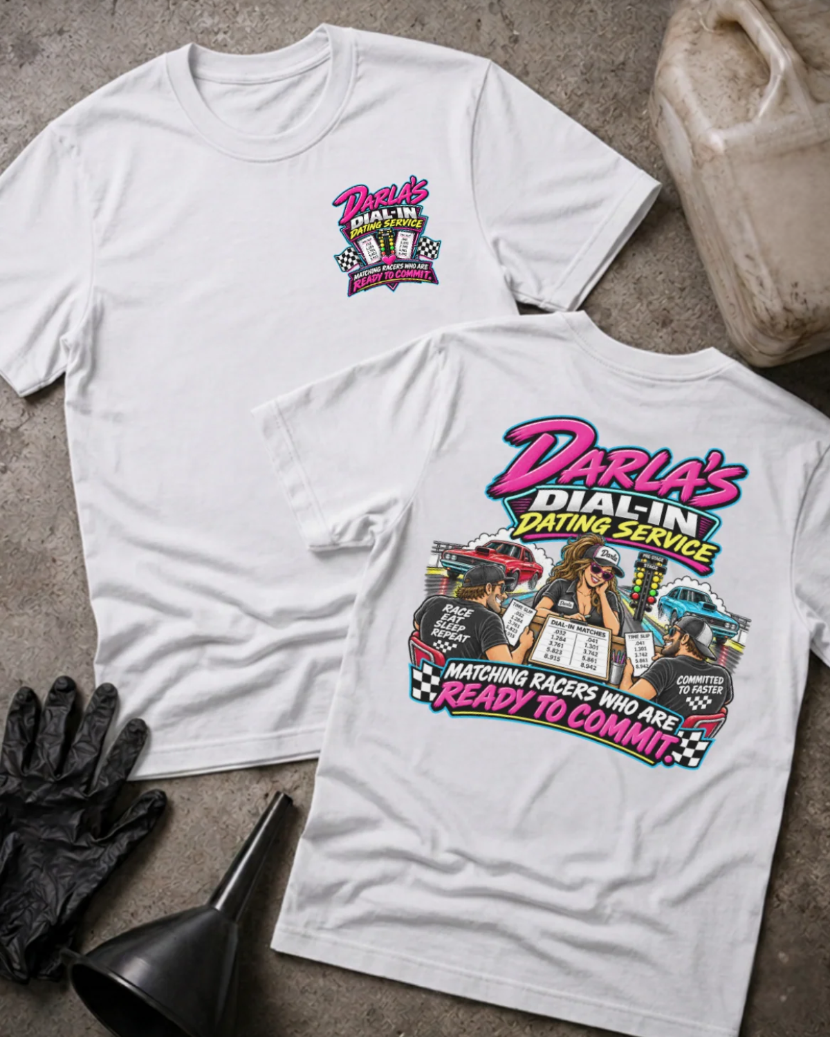 Front and back of Darla’s Dial-In Dating Service white T-shirt with chest logo, woman matching two racers, drag cars, and “Matching racers who are ready to commit” slogan.