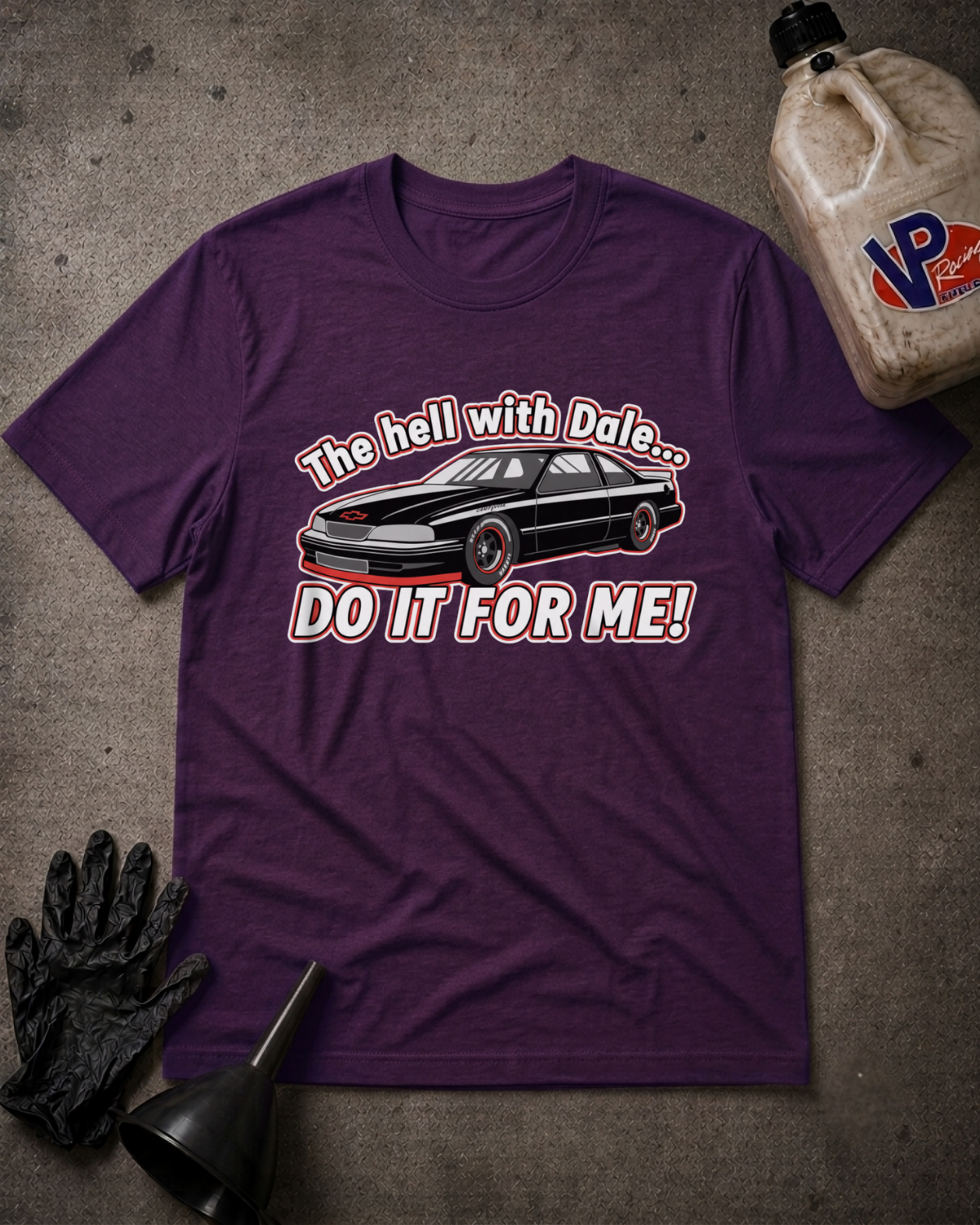 A purple graphic t-shirt featuring a black car and the text 'The hell with Dale.'