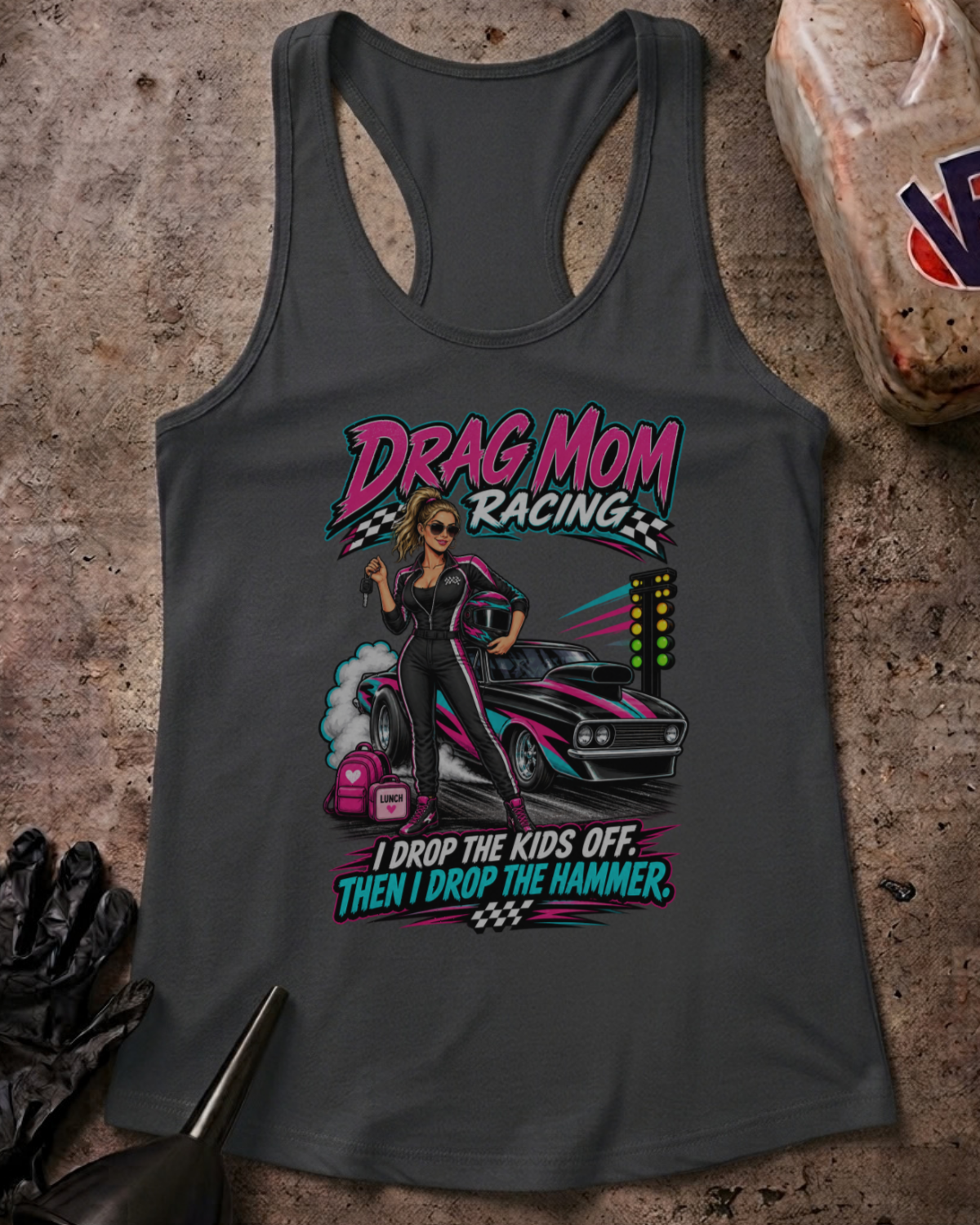 Flat lay of a solid dark grey Drag Mom Racing racerback tank with a drag racing graphic