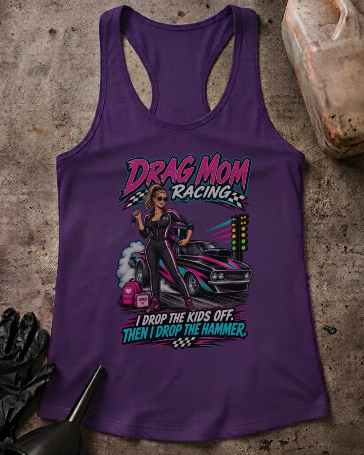Front of Drag Mom Racing solid purple rush racerback tank with woman in a racing suit beside a drag car and “I drop the kids off. Then I drop the hammer” slogan.