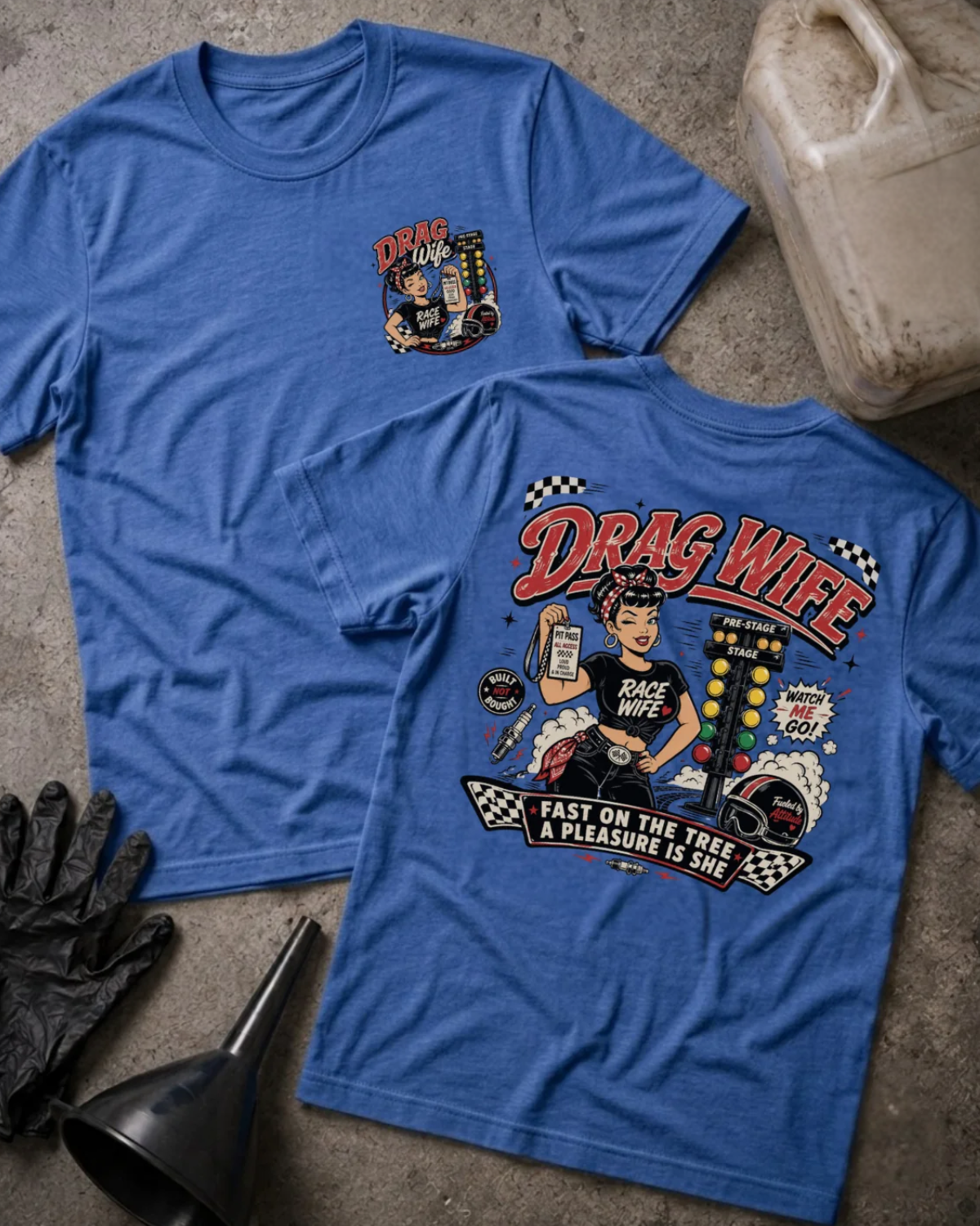 Front and back of Drag Wife heather true royal T-shirt with chest logo, woman holding a pit pass beside drag racing lights, and “Fast on the tree, a pleasure is she” slogan.