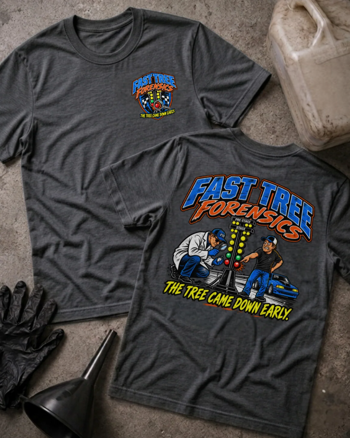 Front and back of Fast Tree Forensics dark grey heather T-shirt with chest logo, two men examining a drag racing starting tree, and “The tree came down early” slogan.