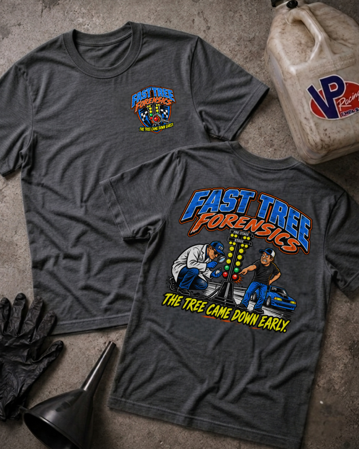 Two dark grey heather graphic t-shirts with a colorful 'FAST TREE FORENSICS' logo on the front and a colorful drag racing graphic with 'FAST TREE FORENSICS THE TREE CAME DOWN EARLY' text on the back