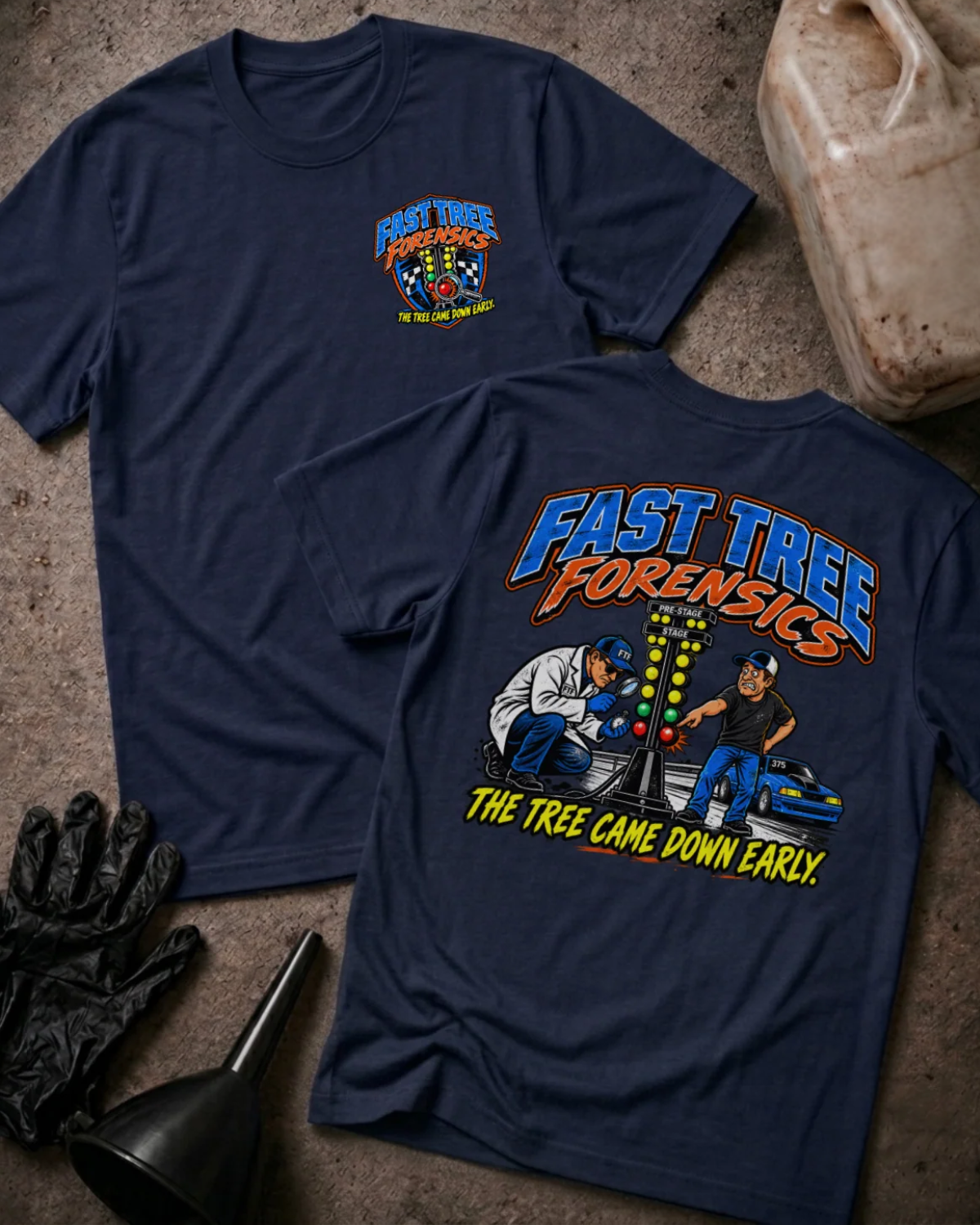 Front and back of Fast Tree Forensics navy T-shirt with chest logo, two men examining a drag racing starting tree, and “The tree came down early” slogan.