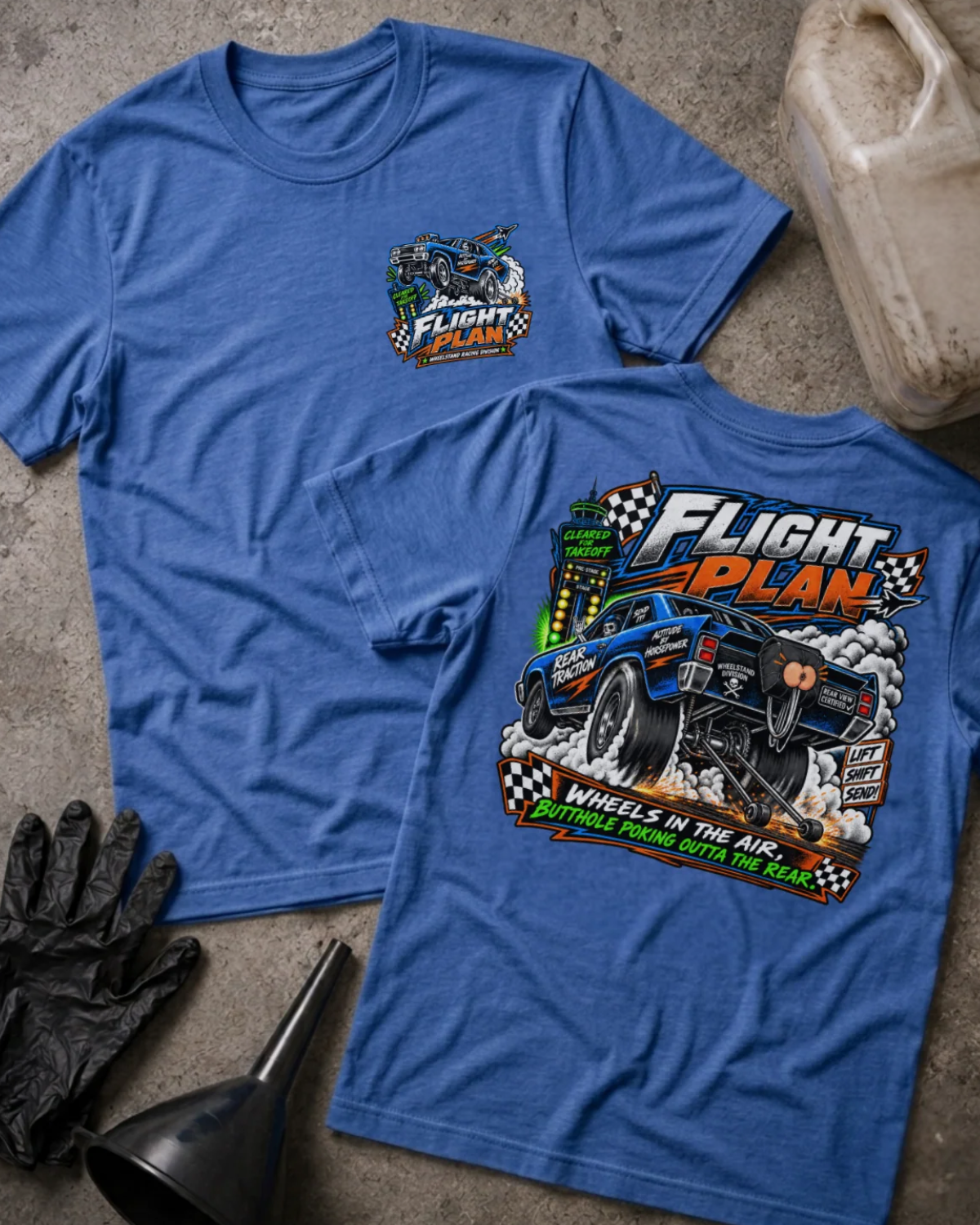 Front and back of Flight Plan heather true royal T-shirt with chest logo, blue drag car performing a wheelstand, and “Wheels in the air, butthole poking outta the rear” slogan.