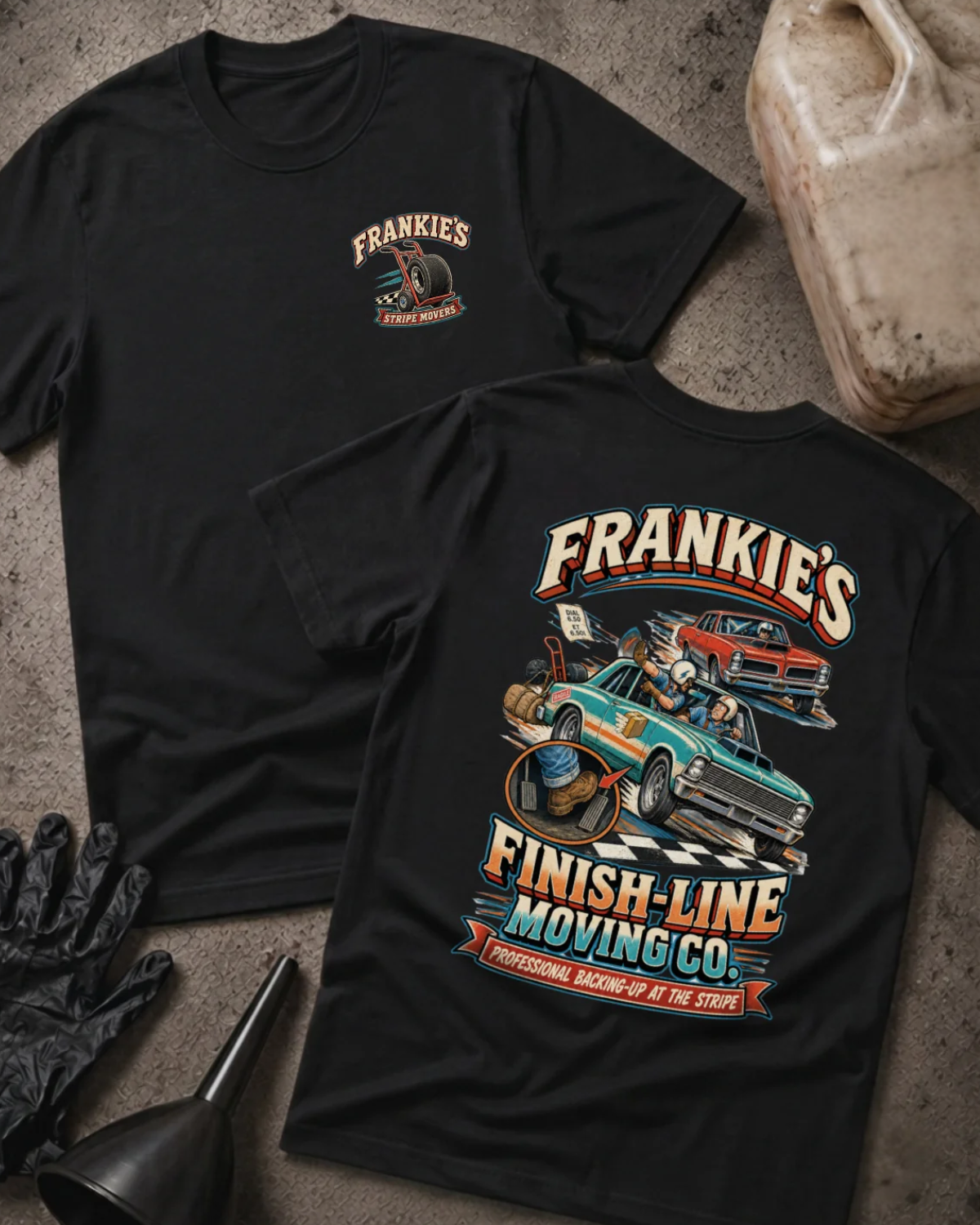 Front and back of Frankie’s Finish-Line Moving Co. black T-shirt with chest logo, green and red race cars at a checkered finish line, and “Professional backing-up at the stripe” slogan.