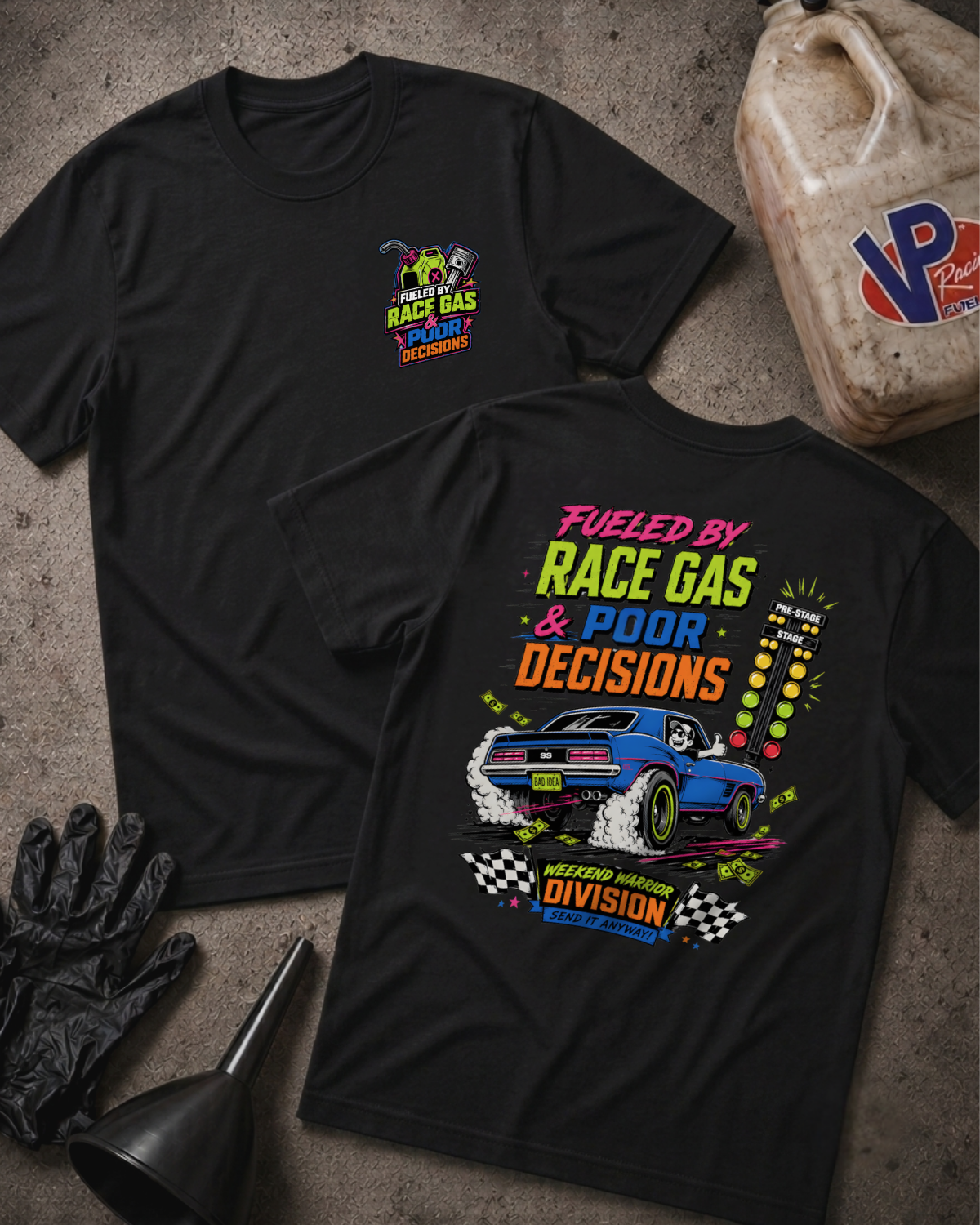Two black graphic T-shirts laid flat on a textured gray surface, with racing-themed printed artwork and 'FUELED BY RACE GAS AND POOR DECISIONS'  text. One shirt shows a small multicolor chest graphic, and the other shows a larger back print featuring a blue race car, neon-style text, and checkered details.
