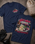 Two navy graphic T-shirts laid flat on a concrete surface, showing the front and back designs. The shirts feature a colorful 'Gap Map Maggie' racing graphic with a cartoon woman in a racing suit, checkered flags, a race car, and the phrase 'She'll show you exactly WHERE YOU GOT LEFT'.