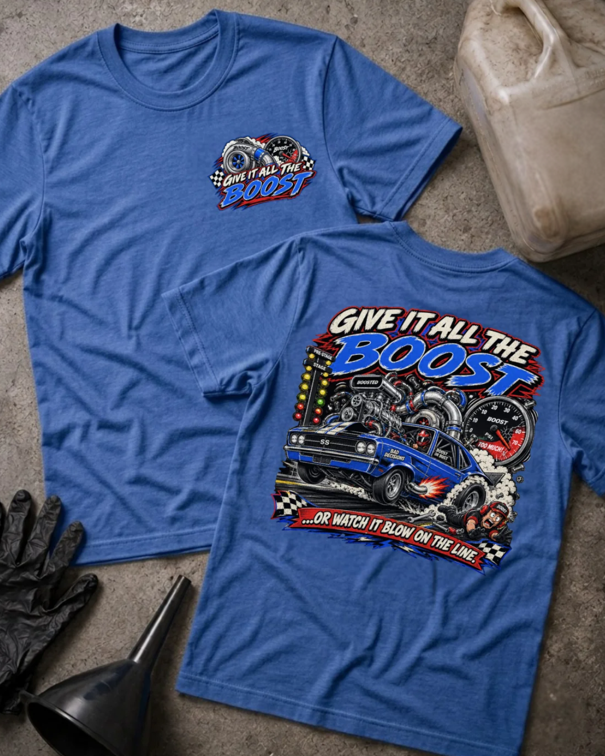 Front and back of Give It All the Boost heather true royal drag racing T-shirt with chest logo, blue turbocharged race car, boost gauge, staging lights, and “Or watch it blow on the line” slogan.