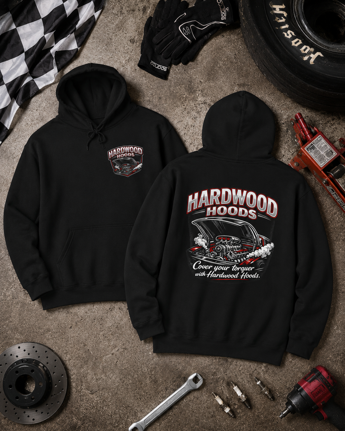 Black hoodies with 'Hardwood Hoods' design on a concrete floor with automotive tools and parts.