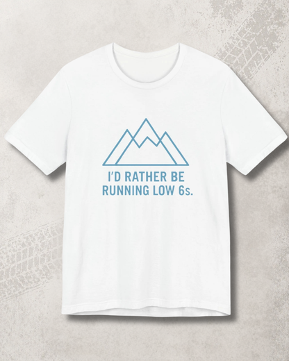 White t-shirt with blue graphic and text on a light gray background