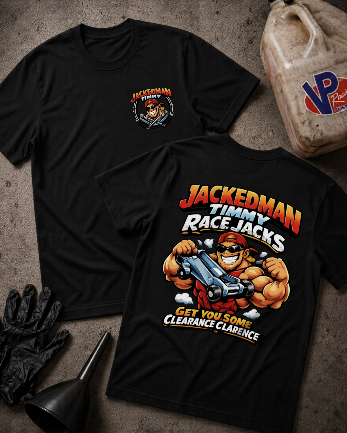 Two black graphic T-shirts laid flat on a textured gray surface, showing the front and back designs. The shirts feature a cartoon racejacker character and the text 'JACKEDMAN TIMMY RACEJACKS' and 'GET YOU SOME CLEARANCE CLARENCE.