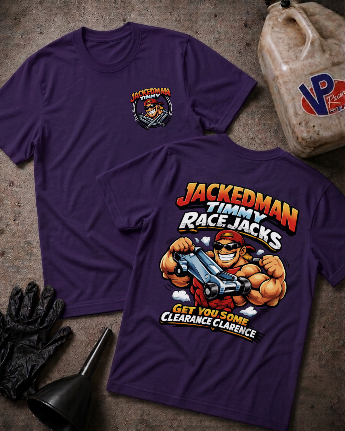 Two purple graphic T-shirts laid flat on a textured surface, showing the front and back designs. The front has a small chest graphic, and the back features a large cartoon character with bold text reading 'JACKEDMAN TIMMY RACE JACKS' and 'GET YOU SOME CLEARANCE CLARENCE.