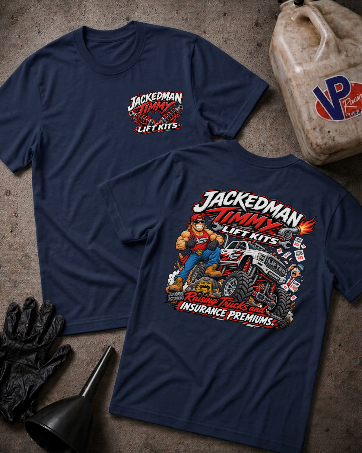Two navy blue graphic T-shirts laid flat on a textured concrete-like surface, with a large front chest logo on one shirt and a large back graphic on the other. The shirts are styled with black gloves, a black funnel, and a dirty plastic jug around them.